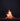 Bonfire burning at night with a dark sky background