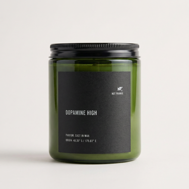 DOPAMINE HIGH luxury candle by NOT FRANKIE in olive green glass jar on a soft neutral background