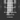 Moody black-and-white background with blurred forest imagery. Bold white text overlays read: “Black leather. Low light. A map you never needed. The ache of choosing freedom over closeness.” Atmospheric and evocative promo image for Frankie & Rose Co.’s Pioneer candle.